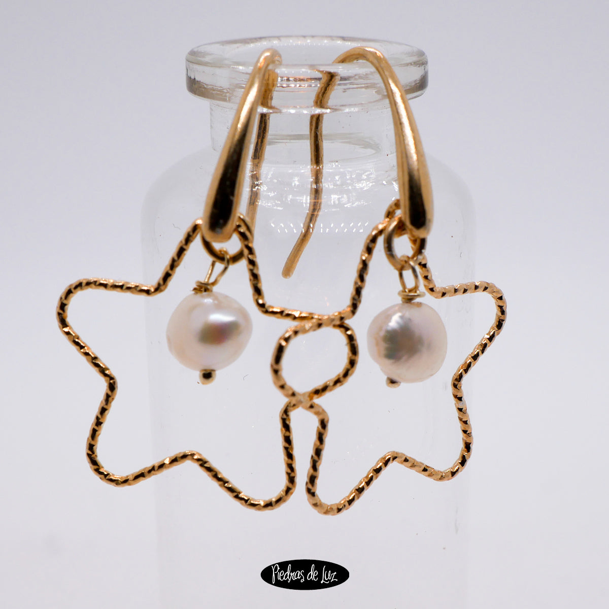 Pendientes estrella y perla en plata dorada